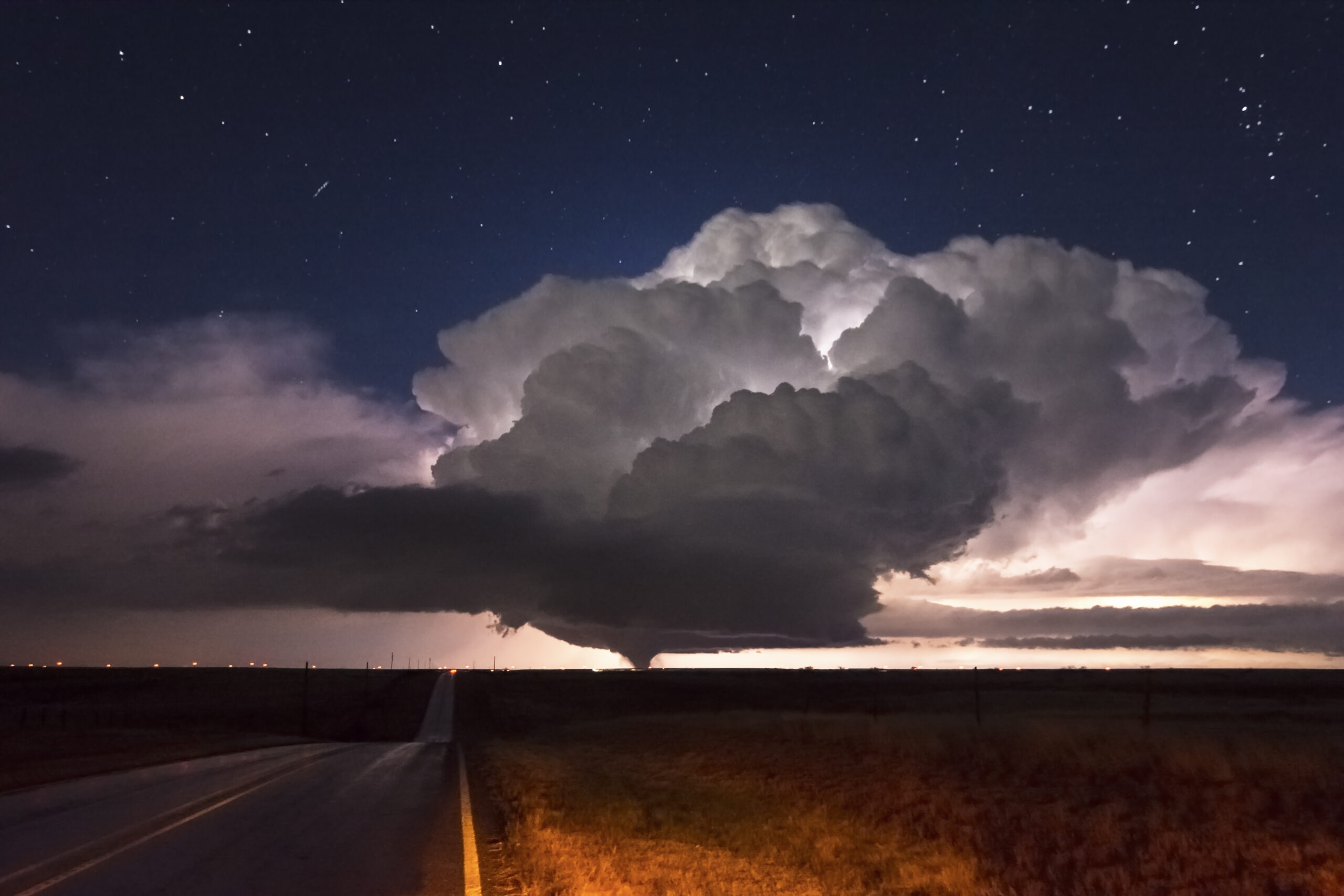 Jenny's bucket list shot of a nocturnal tornado framed by structure and stars in the Palo Duro Canyon (Pampa, TX) on 11/16/2015.